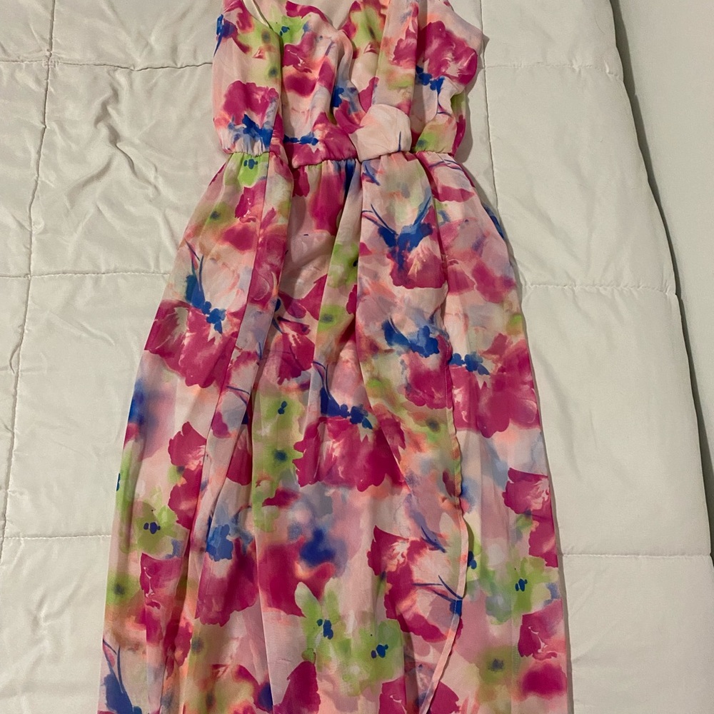 Long tailed dress, short in the front.